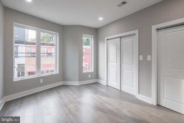 unfurnished bedroom with light hardwood / wood-style floors