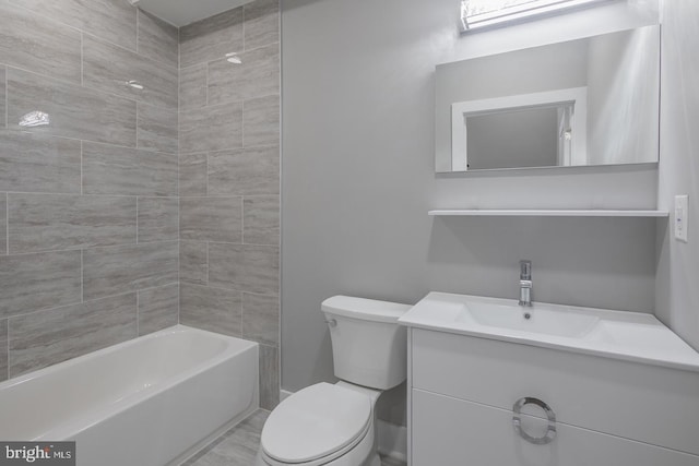 full bathroom with vanity, tiled shower / bath combo, and toilet