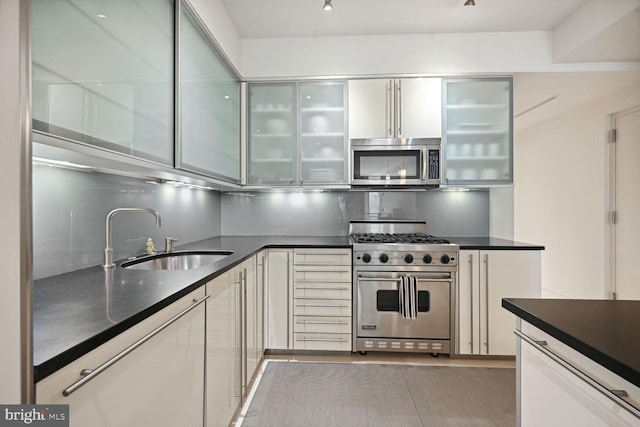 kitchen with sink and appliances with stainless steel finishes