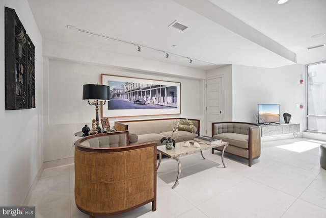 living room with light tile patterned floors