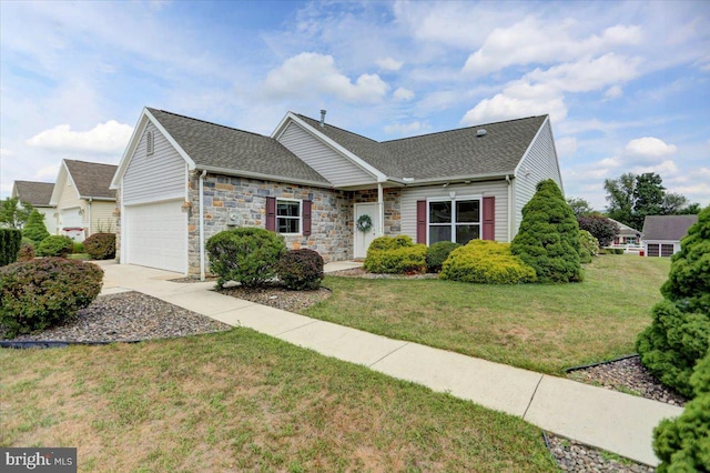 view of front of property with a garage and a front yard