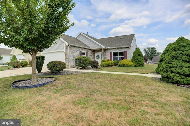 view of front of house featuring a garage and a front lawn