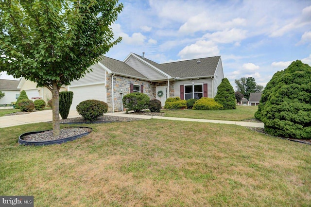 view of front of home with a garage and a front lawn