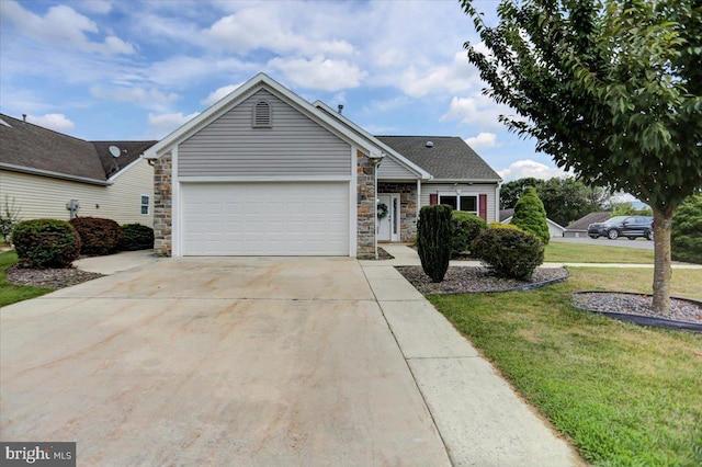 view of front of house with a garage and a front lawn