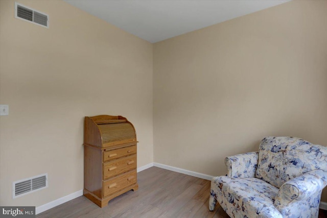 sitting room featuring hardwood / wood-style flooring