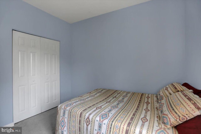 bedroom featuring a closet and carpet