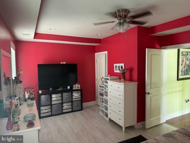 bedroom featuring ceiling fan and light hardwood / wood-style floors