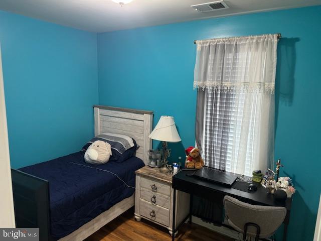 bedroom featuring dark hardwood / wood-style floors