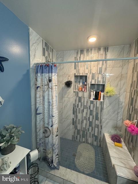 bathroom with curtained shower