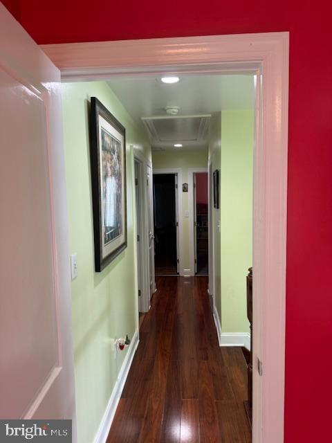 hall with dark wood-type flooring