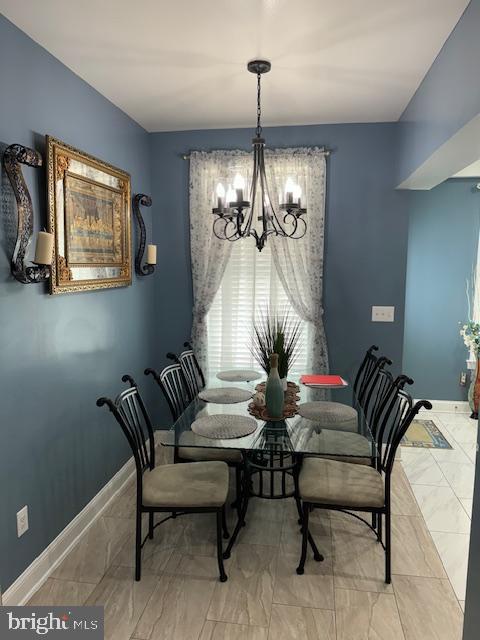 dining space featuring a chandelier