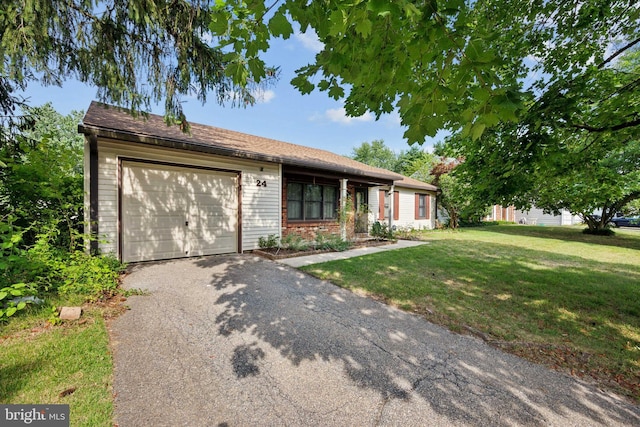 ranch-style house with a front yard and a garage