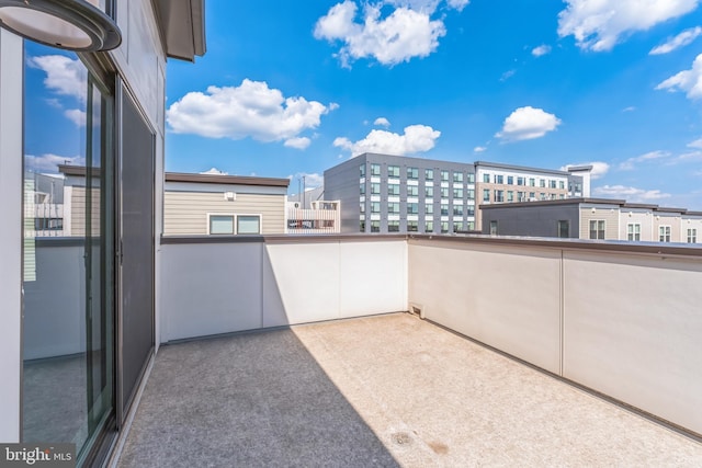 view of patio featuring a balcony