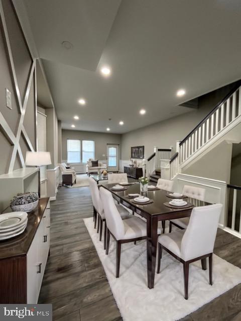 dining area featuring dark hardwood / wood-style floors