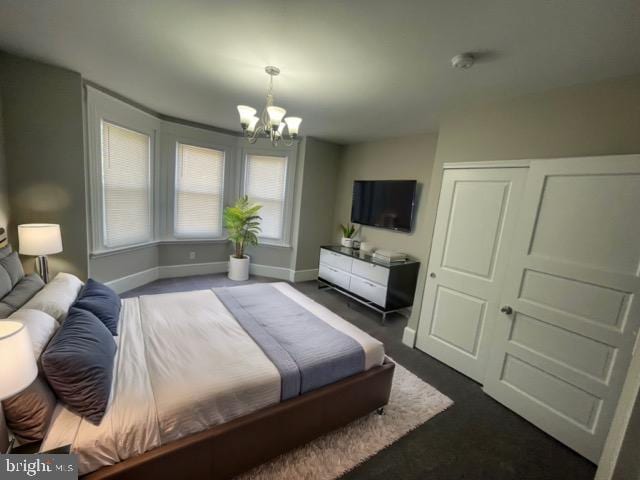 bedroom featuring a closet and a chandelier