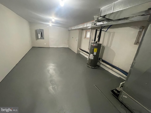 basement with electric water heater and electric panel