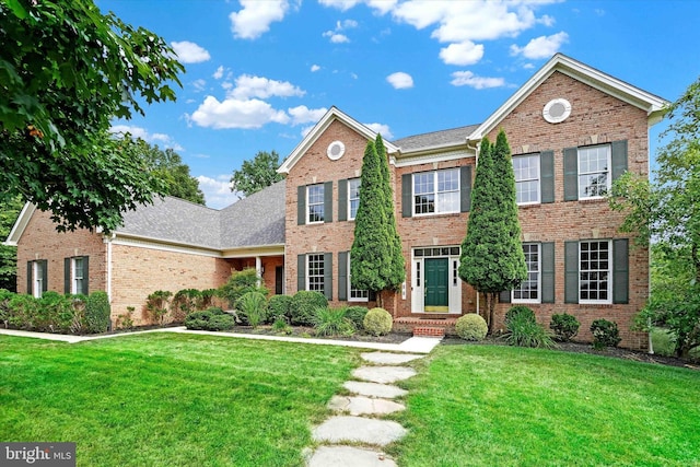 view of front of home with a front lawn