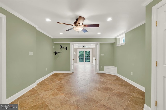 spare room featuring french doors, ceiling fan, and ornamental molding