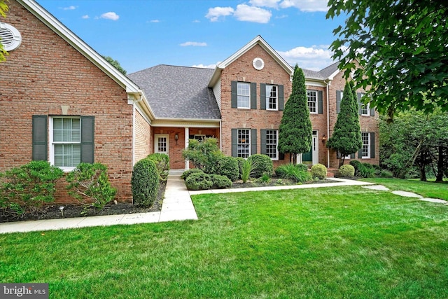 view of front of property with a front lawn