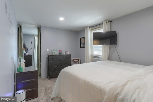 bedroom featuring light colored carpet and cooling unit