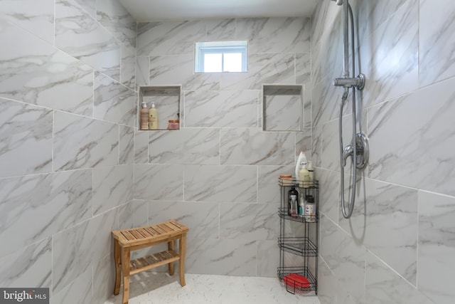 bathroom featuring tiled shower