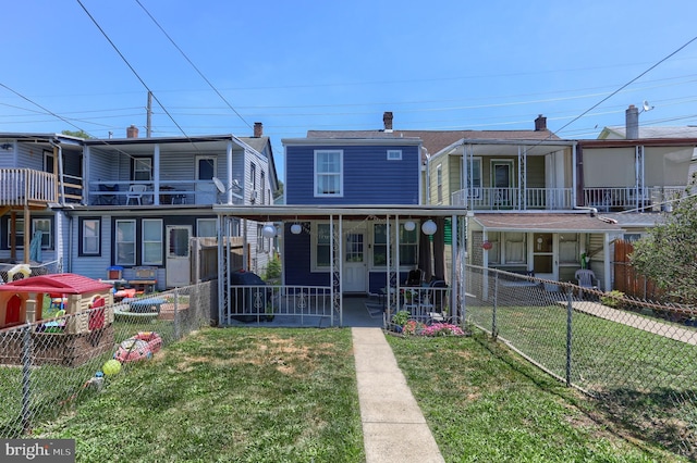 view of front facade with a front yard and a porch