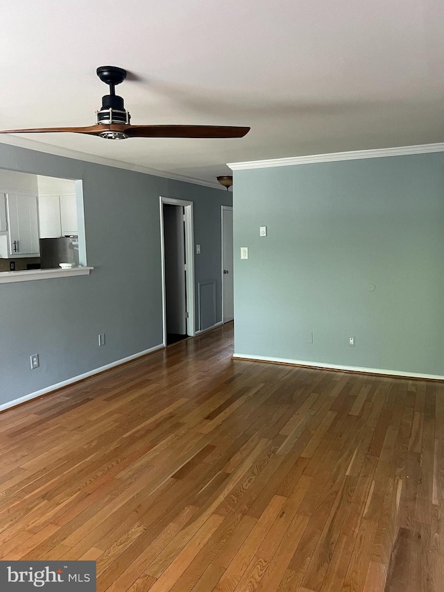 unfurnished room featuring crown molding, ceiling fan, and hardwood / wood-style floors