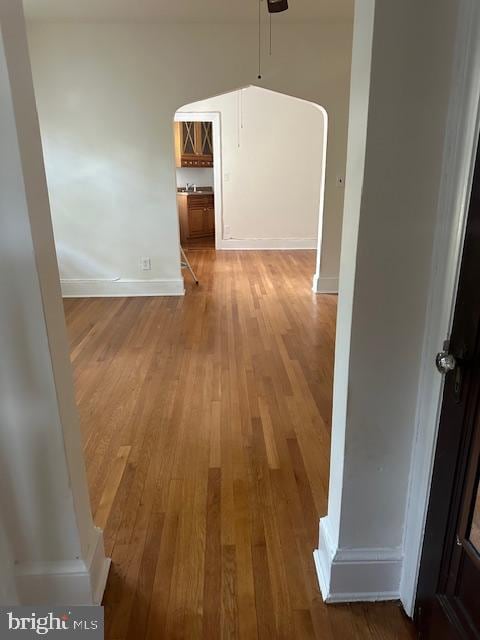 corridor featuring wood-type flooring