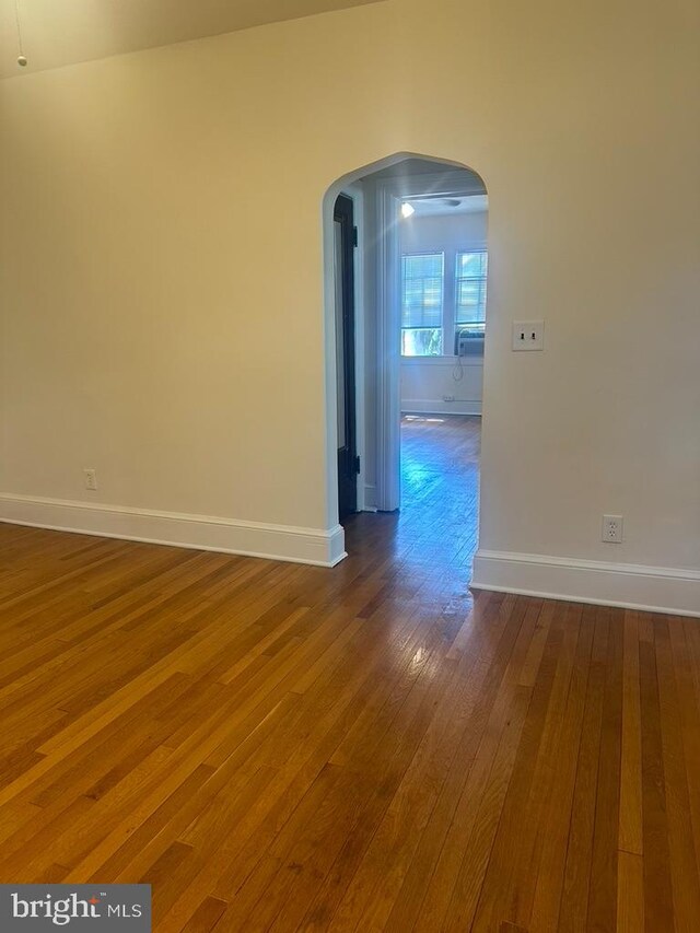 spare room with hardwood / wood-style flooring