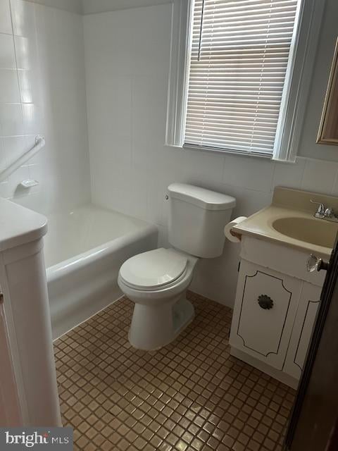 full bathroom featuring  shower combination, tile patterned floors, toilet, and vanity