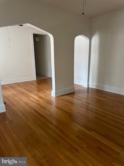 unfurnished room featuring wood-type flooring