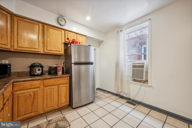 kitchen featuring light tile patterned floors, cooling unit, and stainless steel appliances