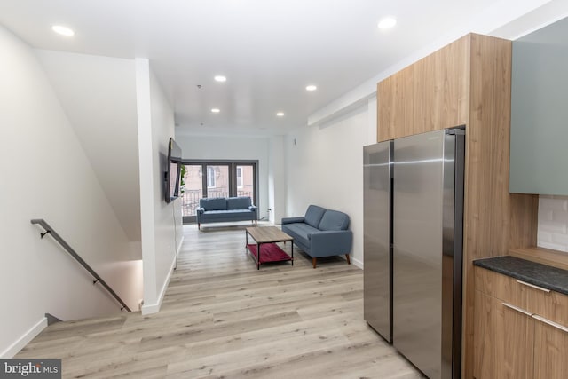 empty room with light hardwood / wood-style floors