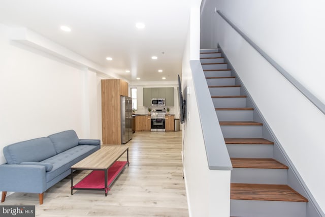 stairway featuring hardwood / wood-style floors