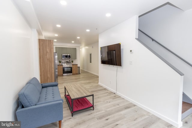 living room with light hardwood / wood-style floors