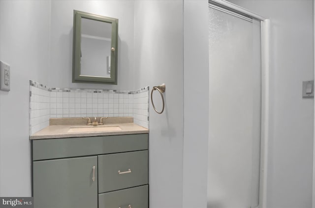 bathroom featuring tasteful backsplash and vanity