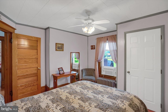 bedroom featuring radiator heating unit, cooling unit, ceiling fan, wood-type flooring, and ornamental molding