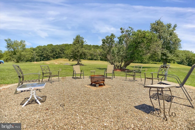 view of yard with an outdoor fire pit