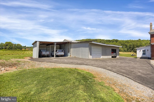 exterior space featuring a carport and a lawn