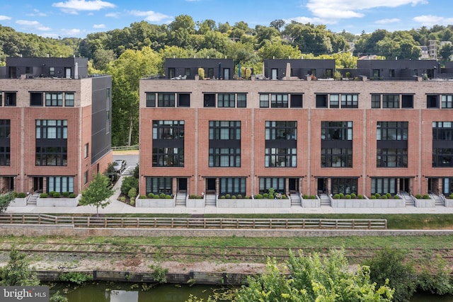 view of property with a water view