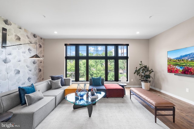 living room with plenty of natural light and wood-type flooring