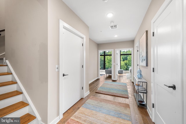 corridor featuring light hardwood / wood-style floors