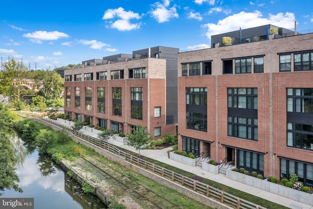 view of building exterior featuring a water view