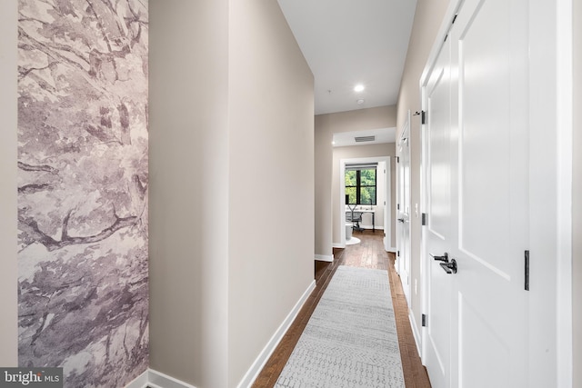 hallway featuring dark wood-type flooring