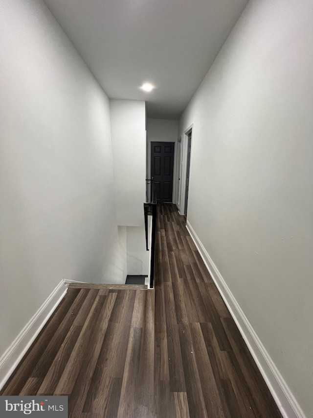 hall with dark hardwood / wood-style floors