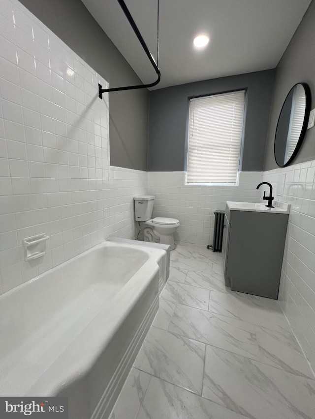 full bathroom with shower / bath combination, tile patterned flooring, tile walls, toilet, and vanity