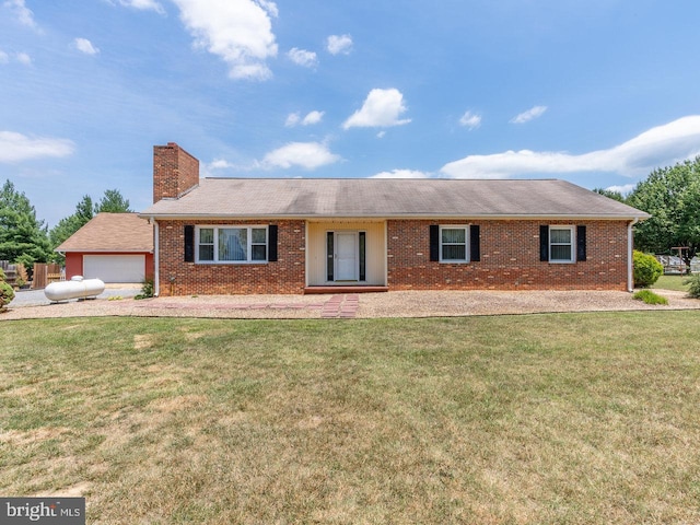 single story home with a front yard and a garage