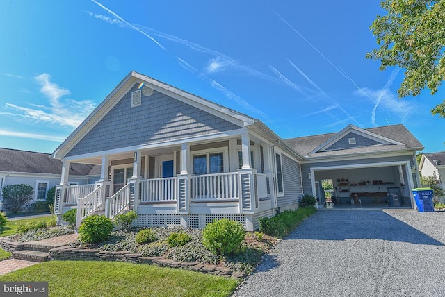 view of front facade featuring a porch and a garage