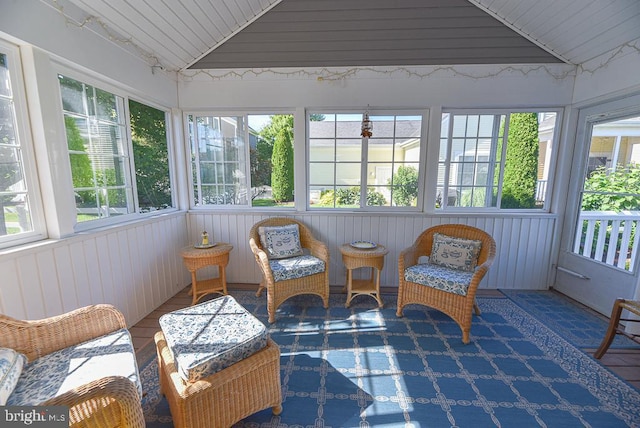 sunroom featuring vaulted ceiling