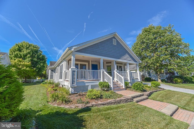 bungalow-style house with a front yard and a porch